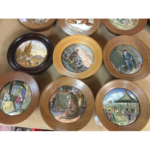 856 - A collection of 18 framed pot lids .