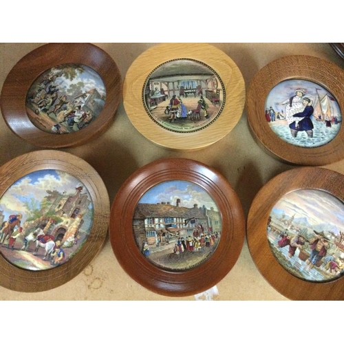 856 - A collection of 18 framed pot lids .