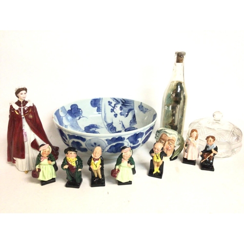 868 - A collection of ceramics including a Royal Worcester Queen figure, Royal Doulton figures, a ship in ... 