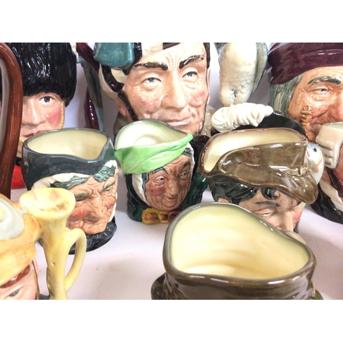 869 - A collection of porcelain Royal Doulton Toby character jugs including Falstaff, Jester, Paddy, Veter... 