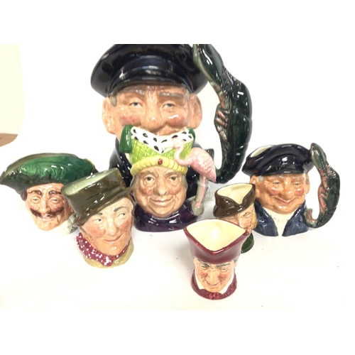 869 - A collection of porcelain Royal Doulton Toby character jugs including Falstaff, Jester, Paddy, Veter... 