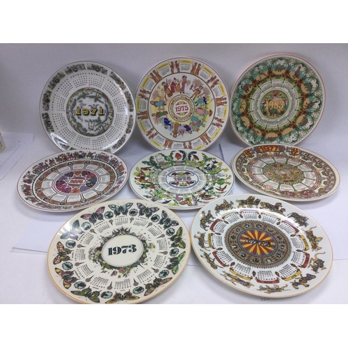 873 - A collection of boxed and loose Wedgwood calendar plates. Shipping category D.