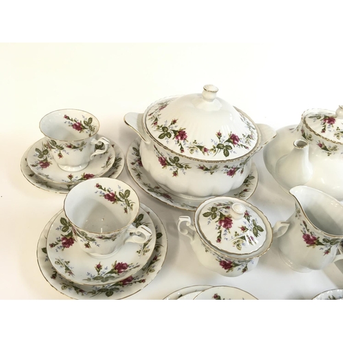 874 - 21 piece Chodziez tea set, comprising of 6 trios, a serving plate, a milk jug and a sugar pot. Also ... 