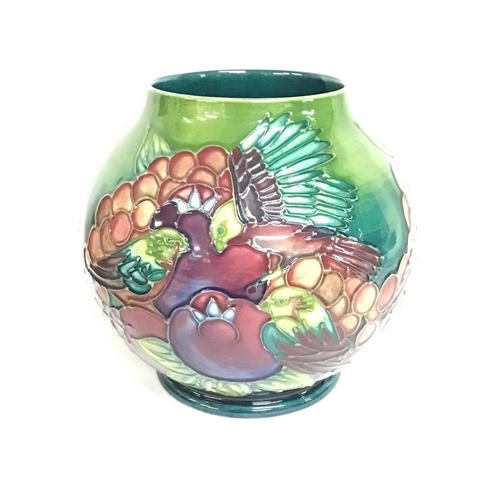 899 - Moorcroft vase decorated with birds and flowers, postage category D