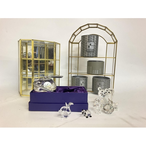 932 - A collection of various boxed Swarovski crystal figures including Edinburgh crystal, display cases. ... 