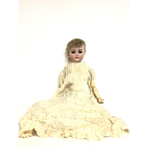 935 - A large Kammer & Reinhardt German porcelain & wooden baby doll, approximately 52cm tall. postage cat... 