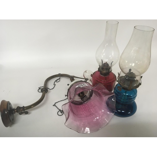 955 - A late Victorian wall gas light converted to electric with a cranberry shade and two other early 20t... 