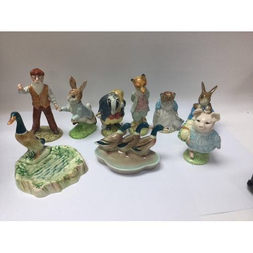 977 - A collection of Beswick and Royal Albert figures including Beatrix potter .