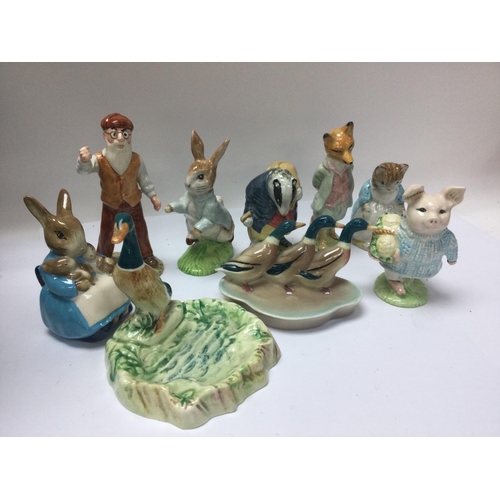 977 - A collection of Beswick and Royal Albert figures including Beatrix potter .