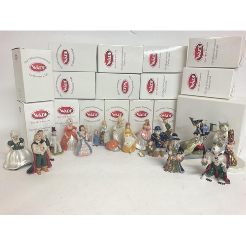 985 - A collection of boxed Wade figures including Beauty & the beast, Peter Pan and Cinderella porcelain ... 