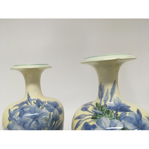 992 - Two pairs of of hand painted Lambeth Doulton vases with flowers and foliage signed bases Hight 28cm ... 