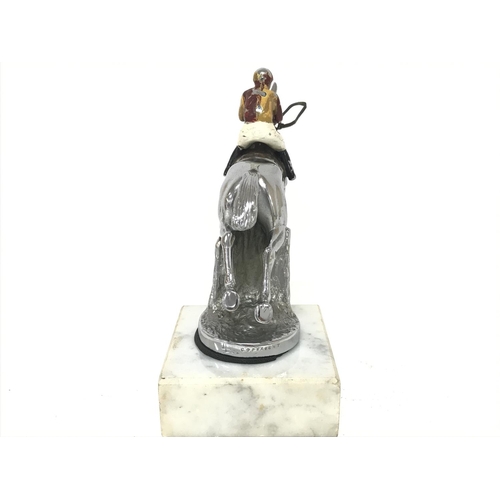 1019 - Chrome car mascot circa 1950s of a show jumping horse and rider mounted on a marble base, 15Cm tall.... 