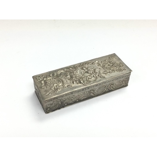 1025 - A small Continental silver box decorated with putti, approx 7.5cm x 2cm x 3cm. Shipping category A. ... 