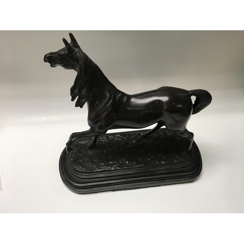 1036 - A bronze model of a horse, Approx 30cm x 33cm.