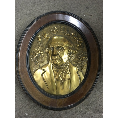 1047 - WITHDRAWN -  A large oval raised brass plaque depicting Gladstone. Measuring 54cm in height