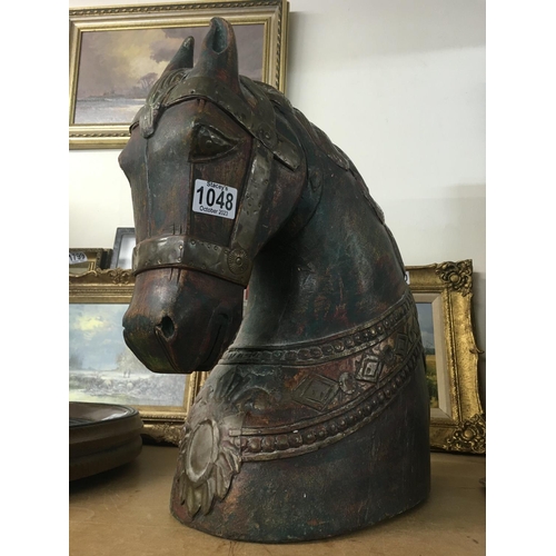 1048 - WITHDRAWN -  A carved horses head with applied brass mounts. Measuring 45cm x 40cm x 20cm approximat... 