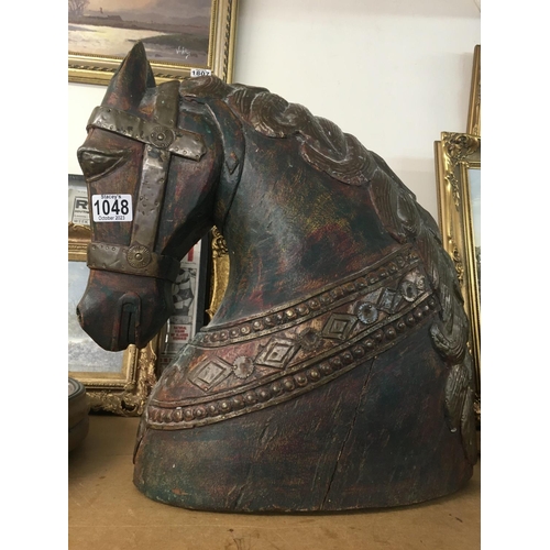 1048 - WITHDRAWN -  A carved horses head with applied brass mounts. Measuring 45cm x 40cm x 20cm approximat... 