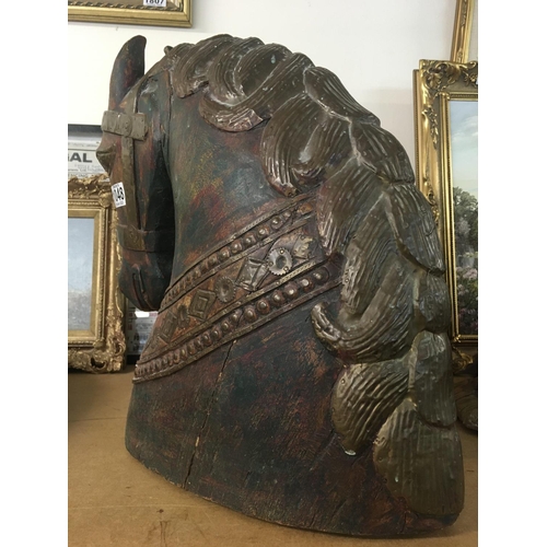 1048 - WITHDRAWN -  A carved horses head with applied brass mounts. Measuring 45cm x 40cm x 20cm approximat... 