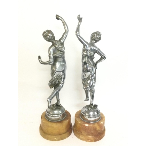 1055 - A pair of chrome Art Deco figures,mounted on marbles bases. Approximately 34cm tall. Postage categor... 