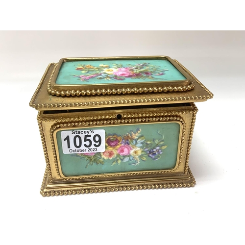 1059 - A French porcelain and gilt metal mounted casket, Tahan Paris, the porcelain panels painted flowers ... 