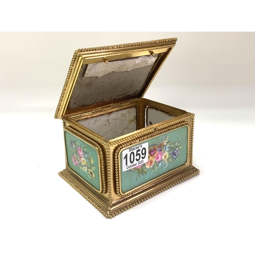 1059 - A French porcelain and gilt metal mounted casket, Tahan Paris, the porcelain panels painted flowers ... 