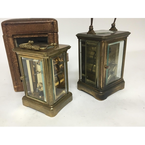 1067 - Two brass carriage clocks maker Matthew Norman of London and one other with a traveling case both se... 