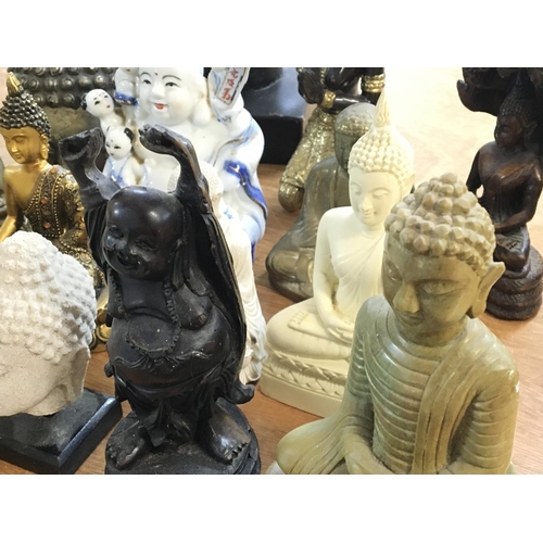 1075 - A collection of Buddha statues, postage cat D