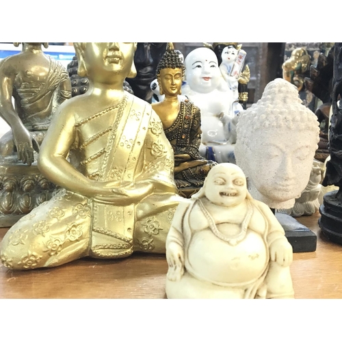 1075 - A collection of Buddha statues, postage cat D