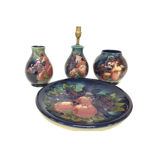 1286 - A collection of Moorcroft Finchs and berries porcelain including vases (17 to 19cm tall), a plate (d... 