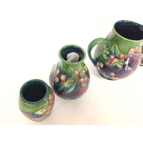 1289 - A collection of Moorcroft vases including a limited to 350 vase designed by Shirley Hayes. Heights r... 