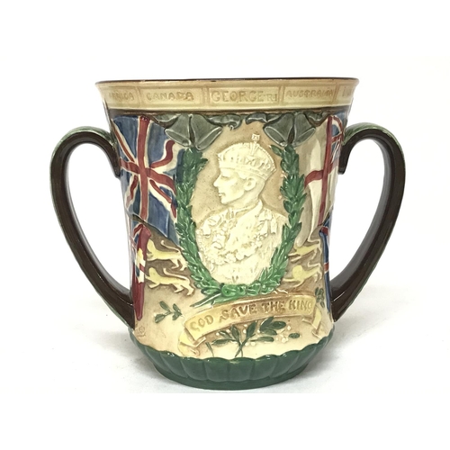 1374 - Doulton Commemorative 1937 coronation two handled beaker. No obvious large damage. 16cm tall. Postag... 