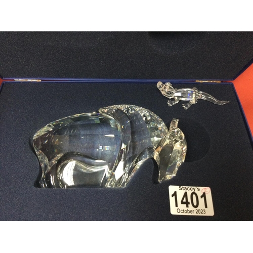 1401 - A Swarovski Bison figure in fitted box together with a Swarovski crocodile in fitted box. No obvious... 