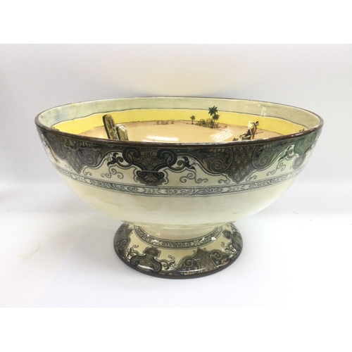 1456 - A Royal Doulton earthenware punch bowl in Desert Scenes pattern, approx diameter 41.5cm. Shipping ca... 