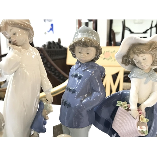 1489 - A Collection of Lladro and Neo porcelain figurines. No obvious large damage or restoration. Postage ... 