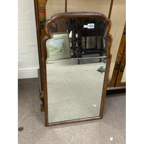 1500 - A 1920s walnut framed wall mirror 83 x 46cm.