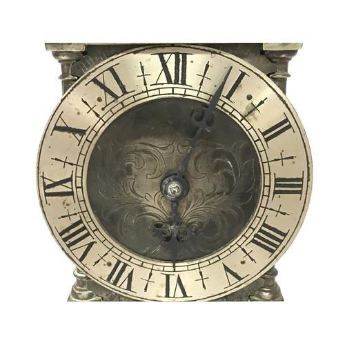 1588 - A brass lantern clock with French movement, in working order. Approximately 30cm tall. Postage categ... 