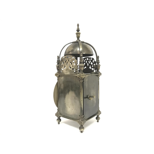 1588 - A brass lantern clock with French movement, in working order. Approximately 30cm tall. Postage categ... 