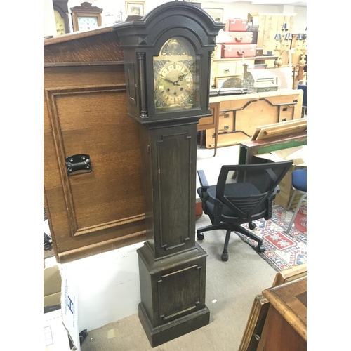 1605 - An Oak Grandmother clock with a brass dial, 160cm tall. Postage category D. NO RESERVE