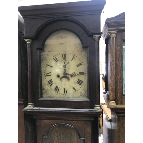 1618 - A oak eight day cased long case clock the a the arched dial with Roman numerals.