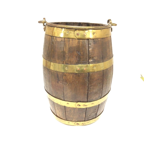 1622 - An oak barrel with brass mounts. 37x 24cm Postage C