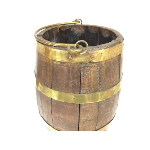 1622 - An oak barrel with brass mounts. 37x 24cm Postage C