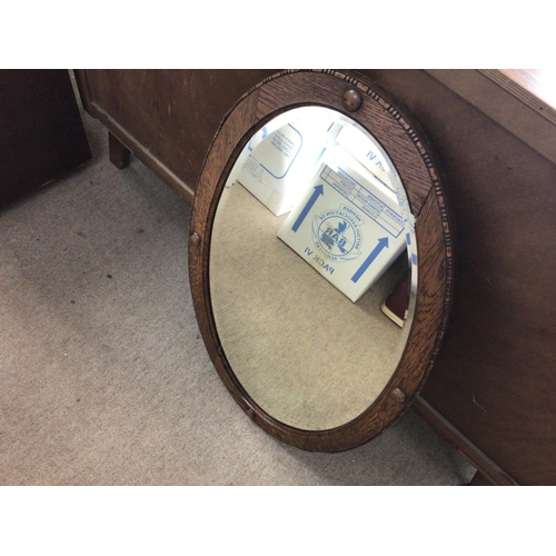 1626 - An oak framed oval mirror 79x59cm and an inlaid barometer 68cm Postage D