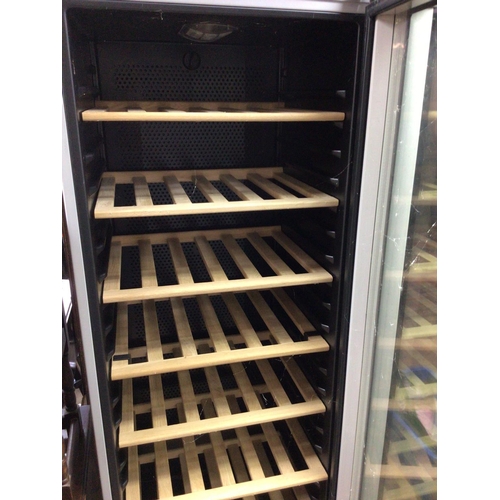 1635 - A large bosch wine fridge with wooden shelves. 184cm high 60 wide and 59 deep