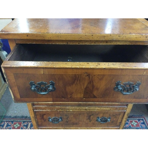 1644 - A walnut chest of drawers. 74cm high 45cm wide 32.5cm deep Postage D