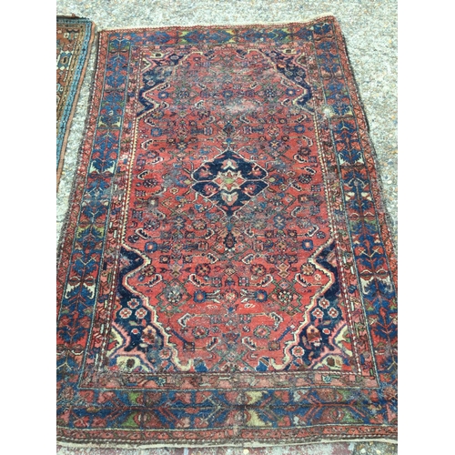 1654 - Hand knotted rugs, dimensions 190x126cm & 278x62cm postage cat D