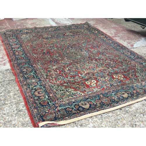 1655 - A large hand knotted rug, approximate dimensions 300x240cm postage category D