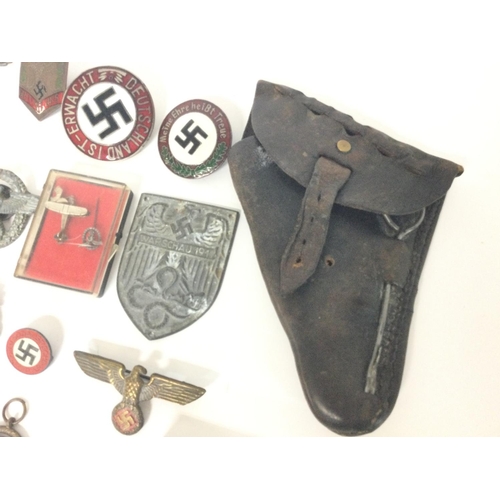 1941 - A collection of reproduction Third Reich pins, badges etc including a leather holster and an SS matc... 