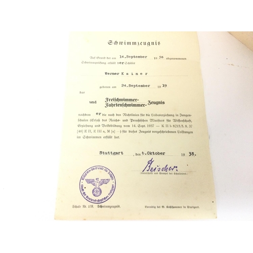 1945 - German Reich Sports Badge and pin presented to a Werner Kainer with a swimming certificate and award... 