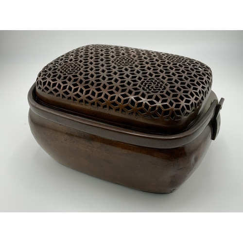 903 - An early Japanese copper Pot Pourri / incense burner with pierced top grill. 16cm x 8cm x 11cm.