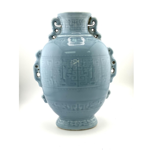 907 - A light blue Chinese ceramic vase with pierced and impressed glazed decoration, Quinlong mark to bas... 